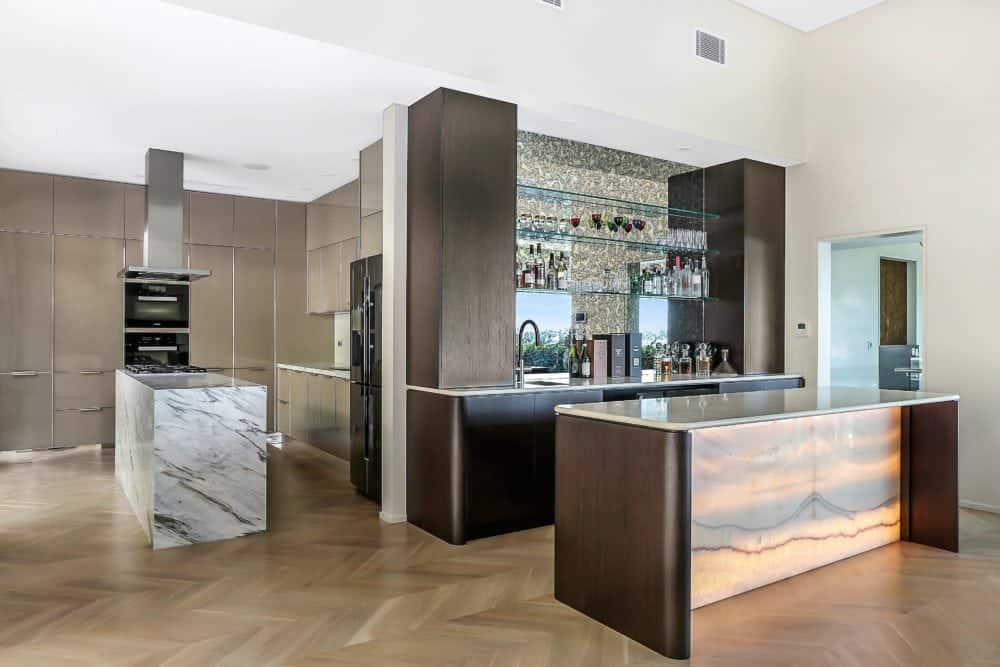calacatta manhattan kitchen island and iris onyx bar feature