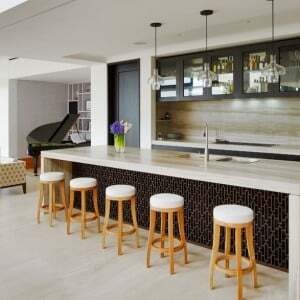 silver travertine kitchen island and splashback