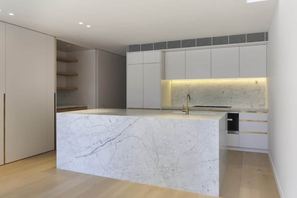 carrara marble kitchen island and splashback